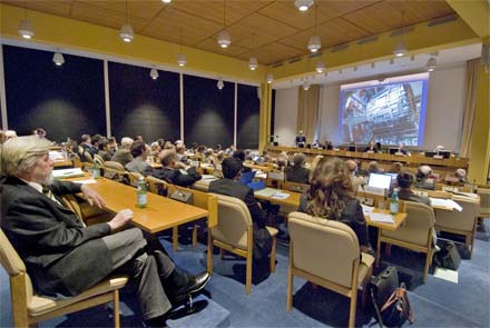 A view from the back of the council chamber. A presentation is in progress